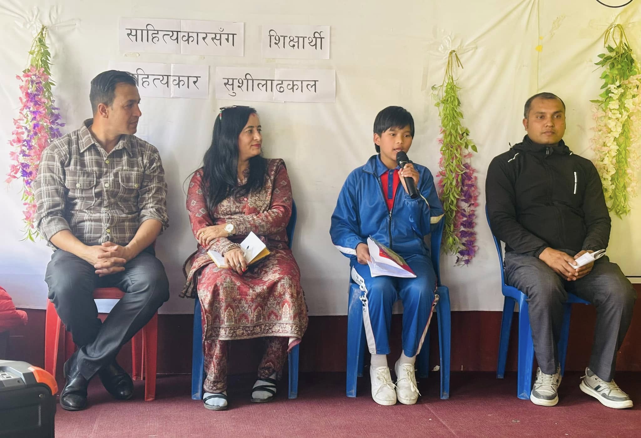 Durga Pun Magar reciting her poem