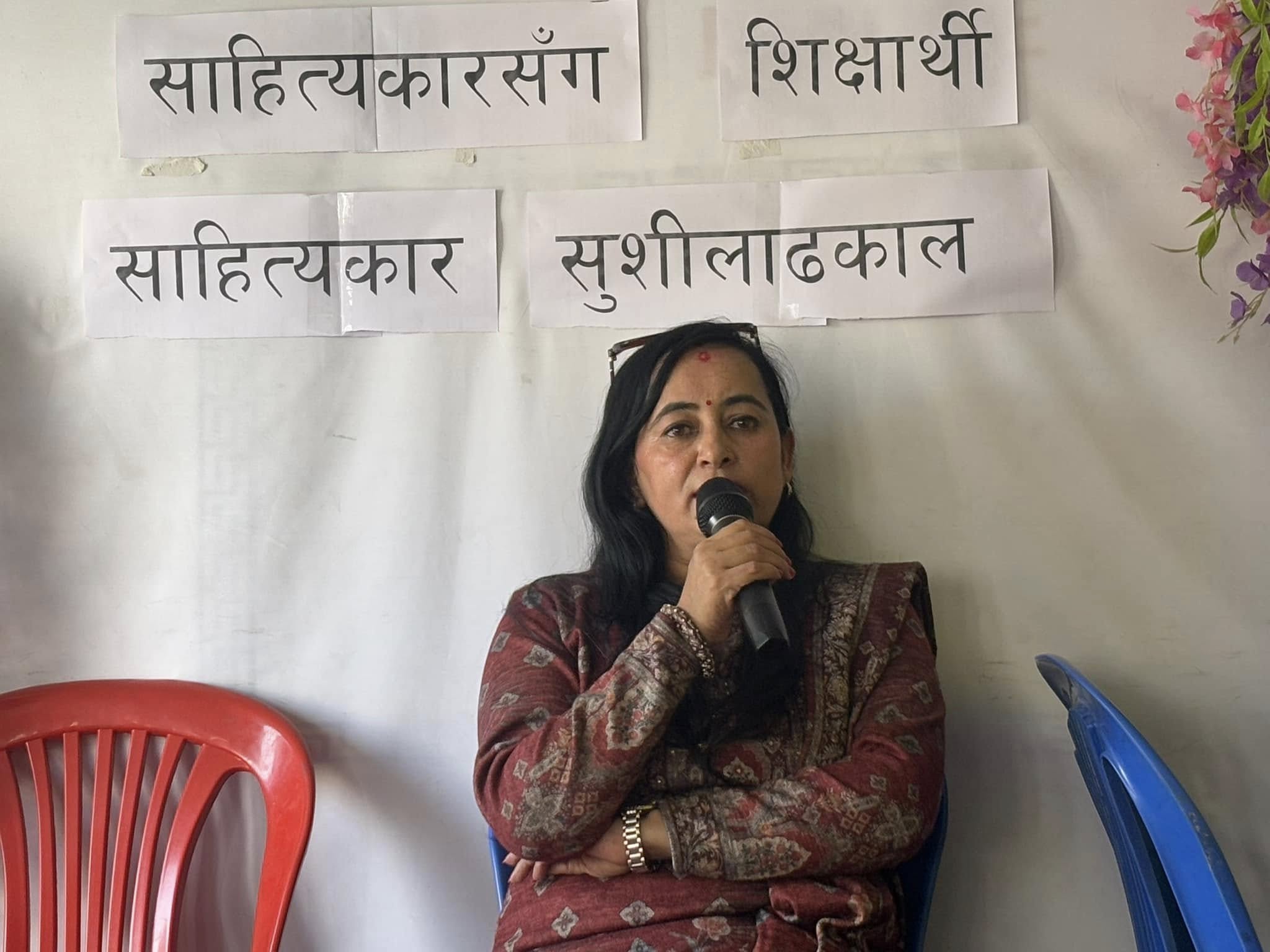 Literary Sushila Dhakal giving her comments